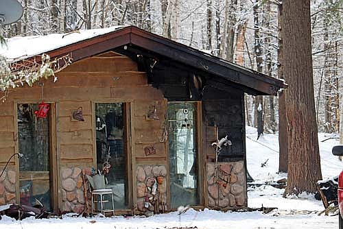 The home on Big Doe Road in Lake Tomahawk damaged by fire Sunday which destroyed a nearby garage. (Photo by Kate Reichl/Lakeland Times)