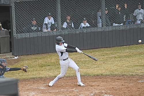 Cooper Johnson hits an RBI single in the fourth inning of the home opener against Tomahawk Monday, April 14 at the Lakeland Union High School baseball field in Minocqua. (Photo by Brett LaBore/Lakeland Times)