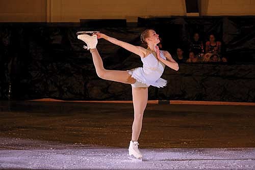 Kirsten Wotruba performs her senior solo during the “Ice, Camera, Action” figure skating show on Friday, April 5, at the Lakeland Hawks Ice Arena in Minocqua. (Photo by Kate Reichl/Lakeland Times)