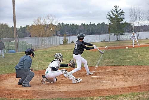 Cooper Johnson takes a swing in a conference game against Rhinelander Friday, April 25 at Stafford Field in Rhinelander. (Photo by Bob Mainhardt for the River News)
