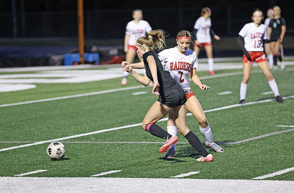 Rhinelander’s Vivian Lamers dribbles around Medford Amelia Persteiner during the second half of a GNC girls’ soccer game at Mike Webster Stadium Thursday, April 24. Lamers scored three goals in the Hodags’ 5-0 victory. (Bob Mainhardt for the River News)