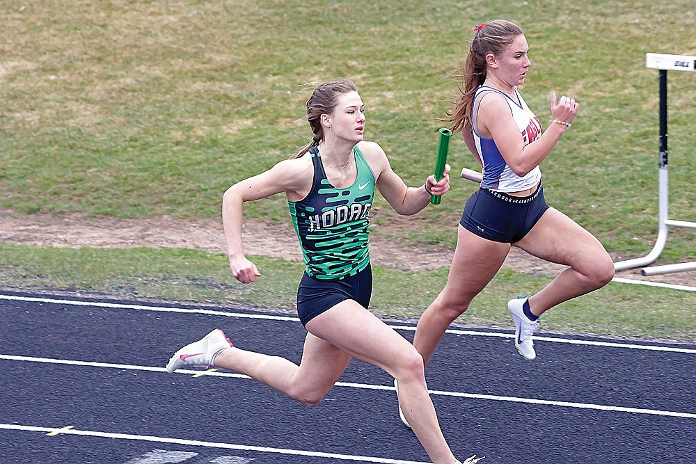 Rhinelander’s Violet Biolo passes Northland Pines’s Ava Carillo over the final stretch of the girls’ 4x100-meter relay during the Eagle Relays track meet at Northland Pines High School in Eagle River Thursday, April 24. Rhinelander won the race, one of six event wins for the Hodags as they took first in the team standings. (Jeremy Mayo/River News)