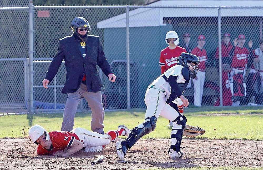 Rhinelander catcher Josh Willoughby receives a throw home late as Medford’s Evan Wilkins scores on a sacrifice bunt during the fourth inning of a GNC baseball game at Stafford Field Tuesday, April 29. Medford scored twice in the fourth inning and defeated the Hodags, 5-3. (Bob Mainhardt for the River News)