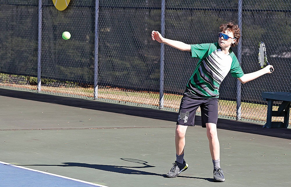 Rhinelander’s Calvin Loomis hits a return during a non-conference boys’ tennis match against D.C. Everest at the RHS tennis courts Tuesday, April 29. Loomis rallied for a 4-6, 6-4, 10-4 victory over Everest’s Brecker Thomas at No. 3 singles as the Hodags defeated the Evergreens, 5-2. (Bob Mainhardt for the River News)