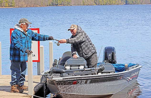 Mike Fischer, left, and Elmber Leitl get ready to go fishing on Wednesday, April 30, at the Rainbow Flowage in Newbold. (Photo by Kate Reichl/Lakeland Times)