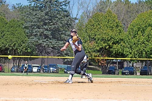 Saylor Timmerman picks up her 1,000th career strikeout in the third inning against Eau Claire Memorial Saturday, May 3 at Gelein Field in Eau Claire. Timmerman is the fifth player in Wisconsin prep softball history to achieve the feat. (Photo by Brett LaBore/Lakeland Times)