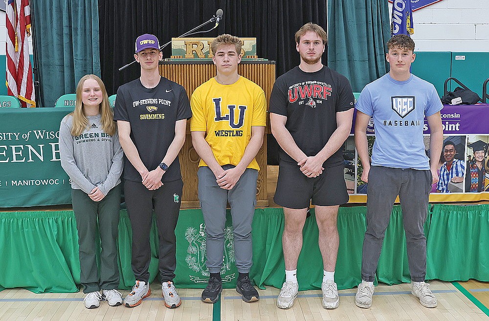 Rhinelander High School seniors, from left to right, Lily Thorsen, Shawn Denis, Logan Schwinger, Bo Stott and Dylan Vanderbunt announced their college athletic plans during RHS senior signing day at the Jim Miazga Community Gymnasium Thursday, May 1. Thorsen will head to Green Bay for women’s swimming, Denis will head to UW-Stevens Point for men’s swimming, Schwinger will head to Lakeland University in Plymouth for wrestling, Stott will head to UW-River Falls for football and Vanderbunt will head to Lake Region State College in Devils Lake, N.D. for baseball. (Bob Mainhardt for the River News)