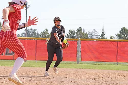 Moriah Louis tosses the ball to first to retire Medford’s Finley Arndt in the first inning of a conference game Tuesday, May 6 at Raider Field in Medford. (Photo by Matt Frey/Star News)