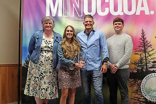 Leadership Academy Martial Arts & Fitness was named Business of the Year at the Community Recognition Awards. Owners Gary and Nikki Engels received the award from Greater Minocqua Area Visitors Bureau president and CEO Krystal Westfahl and board chair Brian Pagani. (Photo by Michael Strasburg/Lakeland Times)