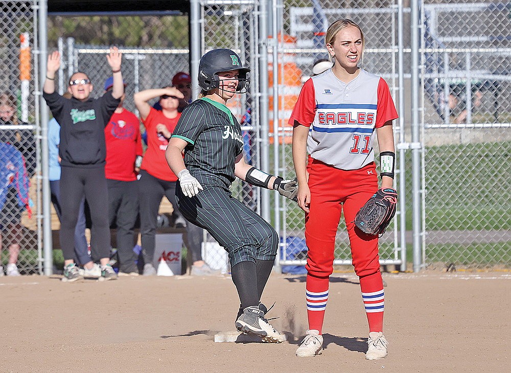 Rhinelander’s Lucy Lindner stops at second in front of Northland Pines’ Maddie Myers after hitting a double during the third inning of a GNC softball game at Andrea Musson Field Thursday, May 8. The Hodags swept a home-and-home series from the Eagles, winning 12-3 Wednesday in Eagle River and 14-1 Thursday in Rhinelander. (Bob Mainhardt for the River News)