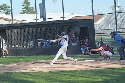 Drew Warren crushes a home run in the fourth inning against Antigo Monday, May 12 at the Lakeland Union High School baseball field in Minocqua. Warren also pitched six innings without allowing an earned run, striking out 12. (Photo by Brett LaBore/Lakeland Times)