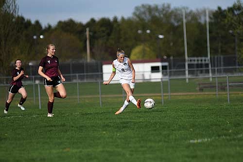 Bobbi Lee shoots and scores in the first half of an 11-1 win over Antigo Tuesday, May 13 at Listle Field in Antigo. Lee scored six goals in two wins over Ashland and Antigo. (Photo by Brett LaBore/Lakeland Times)