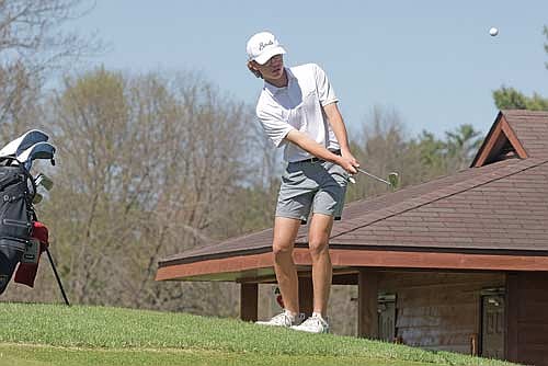 Michael Melka hits a chip shot at the fourth hole of the fourth leg of the GNC Tournament Monday, May 12 at Rhinelander Country Club. Melka led Lakeland with a 77 on Monday and 79 on Tuesday in Minocqua. (Photo by Jeremy Mayo/River News)