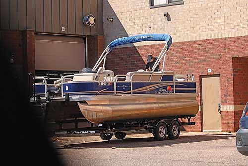 LUHS teacher Jeff Bachinski had his students of his second hour class clean his pontoon boat on Tuesday, May 6, in Minocqua. (Photo by Trevor Greene/Lakeland Times)