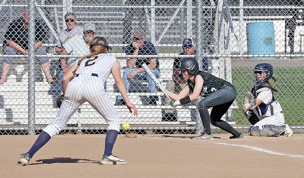 Rhinelander’s Cassidy Lindner bunts during the fourth inning of a GNC softball game against Tomahawk at Andrea Musson Field Monday, May 12. (Bob Mainhardt for the River News)
