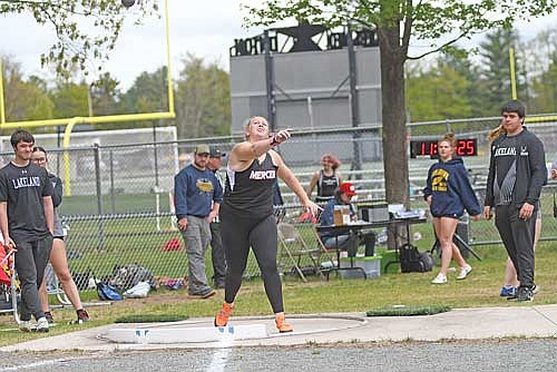 Eiley Schoeneman throws the shot put in the first annual Thunder in the Woods throws fest Saturday, May 17 at Lakeland Union High School in Minocqua. Schoeneman won both the shot put and discus. (Photo by Brett LaBore/Lakeland Times)