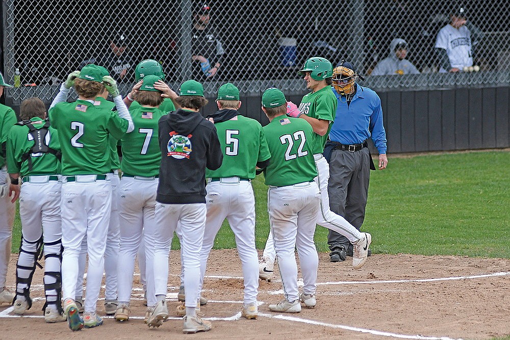 Rhinelander’s Conner Rappley is greeted by his teammates after hitting a home run during the first inning of a GNC baseball game against Lakeland in Minocqua Monday, May 19. The Hodags defeated the T-Birds, 8-4. (Brett LaBore/Lakeland Times)