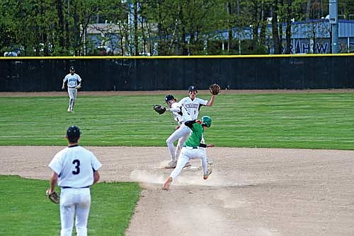 Jack Stella prepares to tag out Rhinelander’s John Turek with Cooper Johnson looking on in the fourth inning Monday, May 19 at the Lakeland Union High School baseball field in Minocqua. (Photo by Brett LaBore/Lakeland Times)