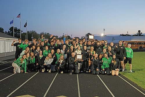 The Rhinelander High School boys’ and girls’ track teams pose with their championship trophies after taking them for a victory lap around Mosinee’s Veterans Park Thursday, May 22. Both teams won their respective Great Northern Conference championships in Mosinee. It marked the first girls’ conference championship in program history, the third in the last seven years for the Hodag boys and the first time since 2021 that a school won both the boys’ and girls’ conference titles in track and field.(Jeremy Mayo/River News)
