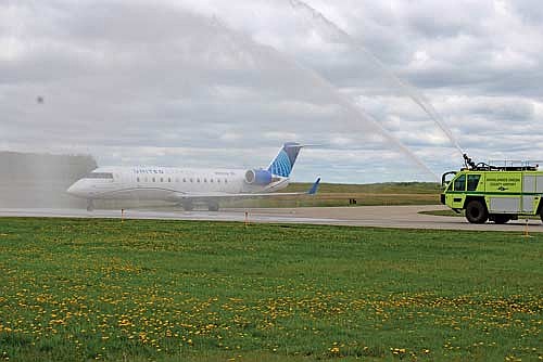 The first United Express flight of the season is welcomed at the Rhinelander-Oneida County Airport with a traditional water canon salute on Thursday, May 22, in Rhinelander. (Photo by Trevor Greene/Lakeland Times)