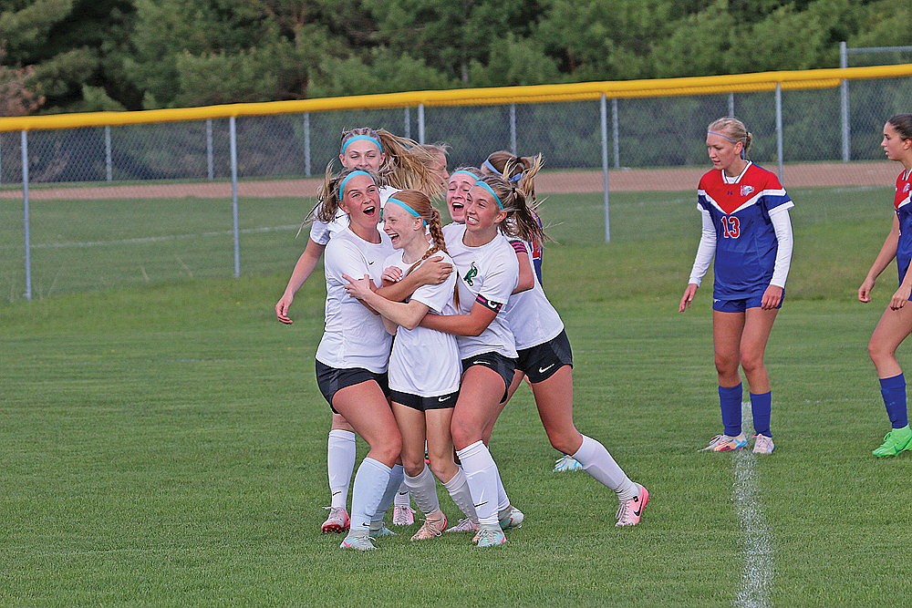 Rhinelander’s Jordan Manske is congratulated by teammates Ella Miljevich, Sophie Miljevich, Kiley Pooch and Vivian Lamers after scoring a goal late in the first half of a GNC girls’ soccer game against Northland Pines in Eagle River Thursday, May 22. Manske scored twice as the Hodags won 4-0 and clinched a share of their first GNC title since 2018. (Bob Mainhardt for the River News)