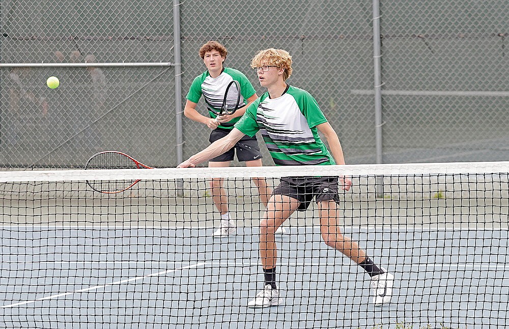 Rhinelander’s Hart Hokens plays a shot at the net while teammate Van Tulowitzky looks on during a WIAA Division 1 boys’ tennis subsectional at the RHS tennis courts Tuesday, May 27. Rhinelander finished second in the subsectional, advancing all three of its doubles flights. (Jeremy Mayo/River News)