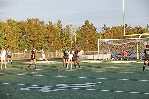 Cale Quade connects on a penalty kick in the second half of a 2-0 win over Rhinelander Thursday, May 29 at Mike Webster Stadium in Rhinelander. Quade’s goal was the go-ahead and game-winning score. (Photo by Bob Mainhardt for the River News)