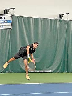 Dominic Gironella follows through in his No. 1 singles match against La Crosse Logan during a WIAA Division 2 sectional meet Thursday, May 29 at John & Fay Menard YMCA Tennis Center in Eau Claire. Gironella won 6-2, 6-0 to advance to state for the second straight season. (Contributed photograph)