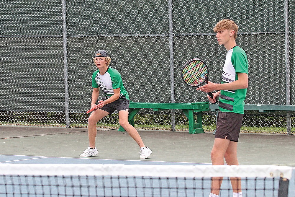 Rhinelander’s Aiden Ostermann, left, awaits a serve while teammate Michael Schiek looks on during a WIAA Division 1 subsectional in Rhinelander Tuesday, May 27. The Hodags’ No. 1 doubles team was eliminated from WIAA state tournament contention with a straight set loss against Hudson during sectional play Wednesday in Eau Claire. (Bob Mainhardt for the River News)