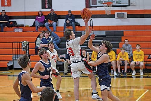 In this Dec. 19, 2024 file photo, Richie Allen goes for a shot in a non-conference game against Tomahawk at Coach Leverson Court in Mercer. (Photo by Brett LaBore/Lakeland Times)