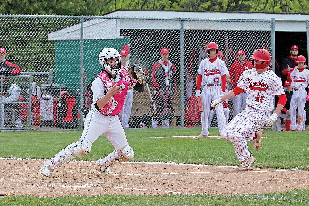 Rhinelander’s Jackson Waydick, left, looks to turn a double play after forcing Marathon’s Owen Chrouser out at home during the second inning of a non-conference baseball game at Stafford Field Friday, May 23. Waydick earned first-team honors in the Great Northern Conference at catcher, the league announced on Saturday. (Bob Mainhardt for the River News)