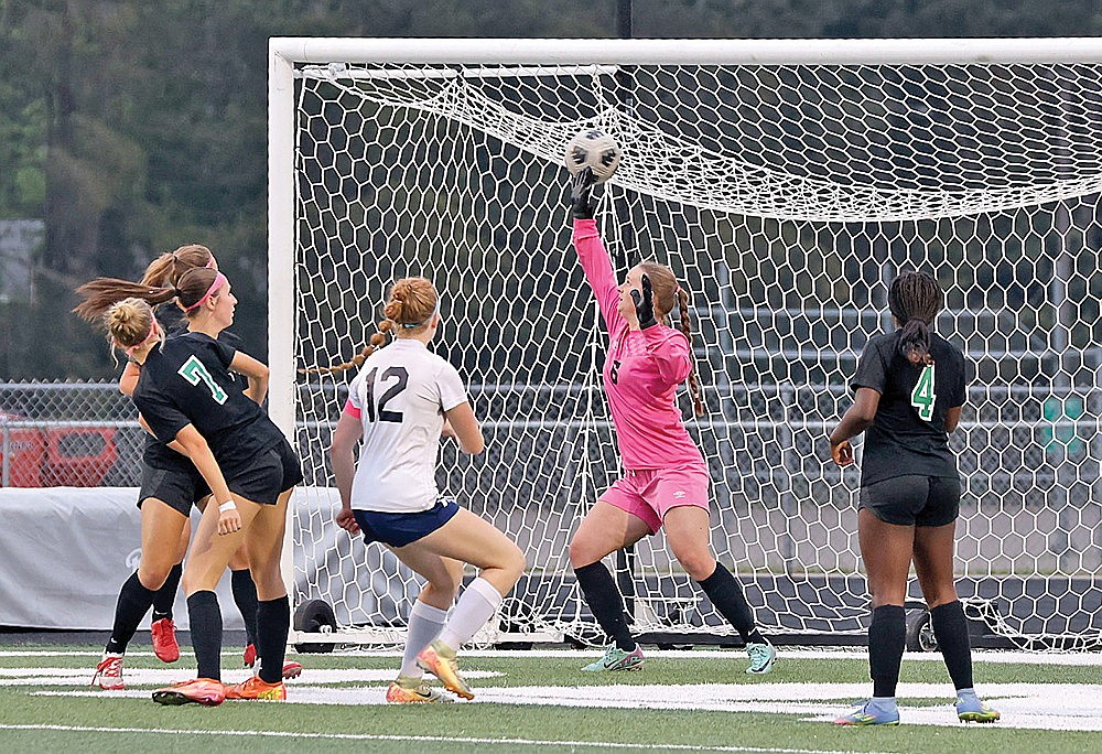 Waupaca’s Taylor Kling (12) heads a shot past Rhinelander goalkeeper Rylee Mickevicius during the second half of a WIAA Division 2 regional final girls’ soccer game at Mike Webster Stadium Saturday, June 7. Kling scored what proved to be the game-winning goal as the Comets upset the top-seeded Hodags, 2-1. (Bob Mainhardt for the River News)