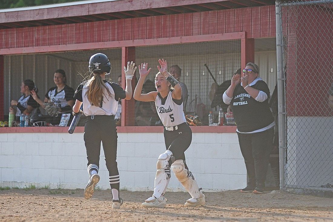 Lani Frisch (5) is fired up after Allyson Seaberg’s go-ahead run scored in the seventh inning of a WIAA Division 2 sectional semifinal game against Medford Wednesday, June 4 at Raider Field in Medford. (Photo by Brett LaBore/Lakeland Times)