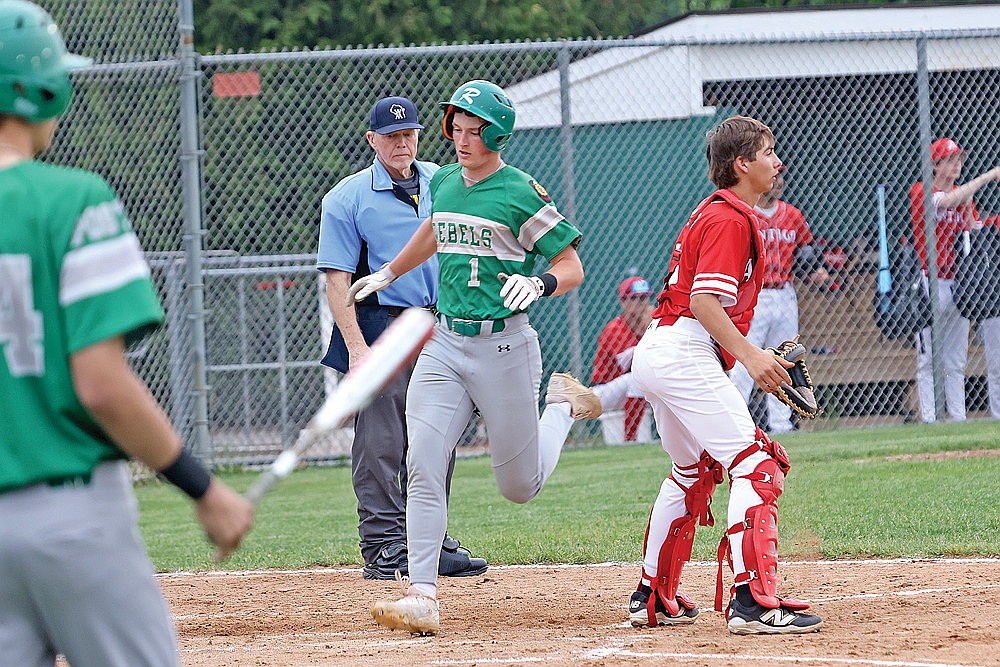 Rhinelander’s Dylan Vanderbunt scores on an RBI single by Conner Rappley during the first inning of an American Legion baseball game against Antigo at Stafford Field Wednesday, June 11. Vanderbunt went 4-for-4 with a pair of doubles and three runs scored in the Rebels’ 16-6 victory over the Typhoon. (Bob Mainhardt for the River News)