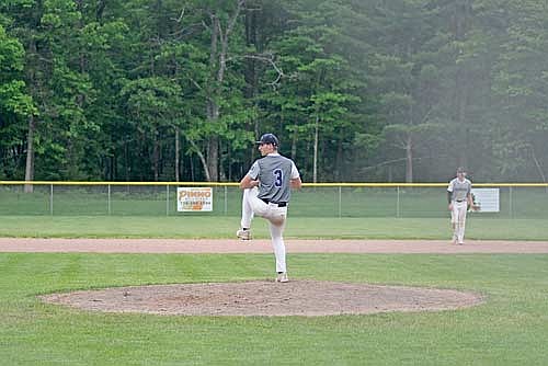 Ben Peterson goes through his wind-up against Northwoods Wednesday, June 11 at the Minocqua Park Complex. Peterson threw three no-hit innings with nine strikeouts. (Photo by Brett LaBore/Lakeland Times)