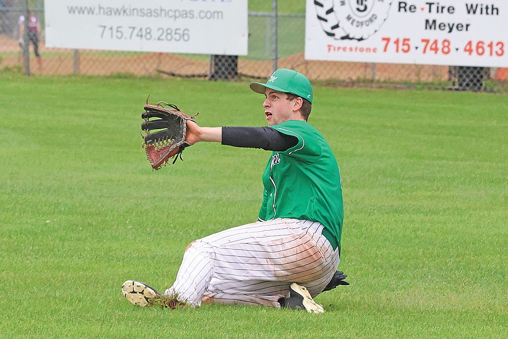 Rhinelander’s Sam Schneider slides to make a catch during the sixth inning of a Dairyland Large baseball game at Whittlesey Sunday, June 15. (Matt Frey/Star News)