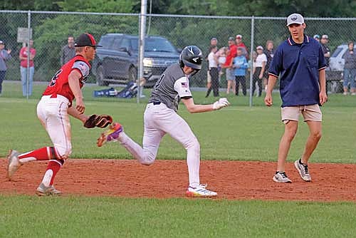 Medford shortstop Parker Lissner tags out Jack Stella trying to stretch a single into a double in the seventh inning Wednesday, June 18 at Jaycee Field in Medford. (Photo by Matt Frey/Star News)