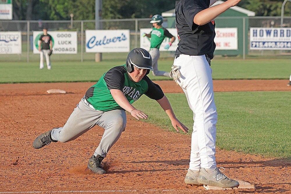 Rhinelander’s Douglas Hartmann dives into third base, advancing on a passed ball, during the third inning of a Northwoods Babe Ruth Senior League baseball game against Phillips at Stafford Field Thursday, June 19. (Jeremy Mayo/River News)