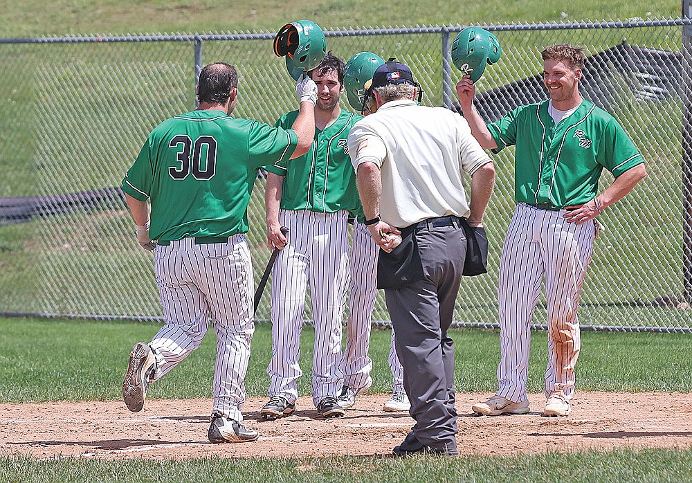 Rhinelander’s Jacob Dreifuerst (30) celebrates with teammates Martin Hoger, center, and Tyler Blomdahl, right, after hitting a home run in the second inning of a Dairyland League baseball game against the Marshfield Chaparrals at Stafford Field Sunday, June 22. Dreifuerst went 3-for-4 with six RBIs in the River Monsters’ 18-15 win. (Bob Mainhardt for the River News)