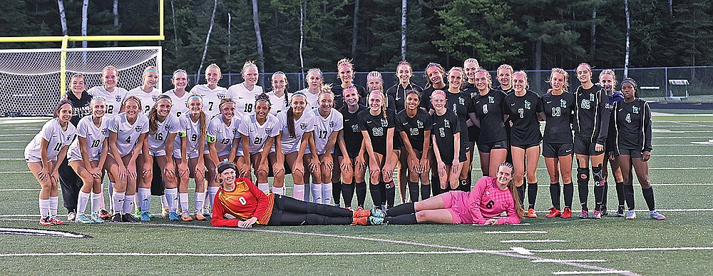 The Rhinelander High School girls’ soccer team, in black, poses with the Lakeland Union High School girls’ soccer team after the squads shared the Great Northern Conference title May 29, 2025 at Mike Webster Stadium. Rhinelander had a chance to win the conference title outright but lost to Lakeland 2-0 in the final conference game of the season. (Bob Mainhardt for the River News)