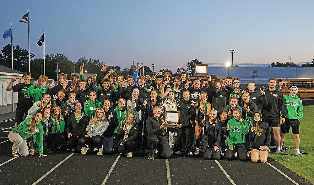 In this May 22, 2025 file photo, the Rhinelander High School boys’ and girls’ track teams pose with the Great Northern Conference championship trophies after sweeping both conference titles in Mosinee. It marked Rhinelander’s third boys’ conference title in the last seven years and the first girls’ conference title in program history. (Jeremy Mayo/River News)
