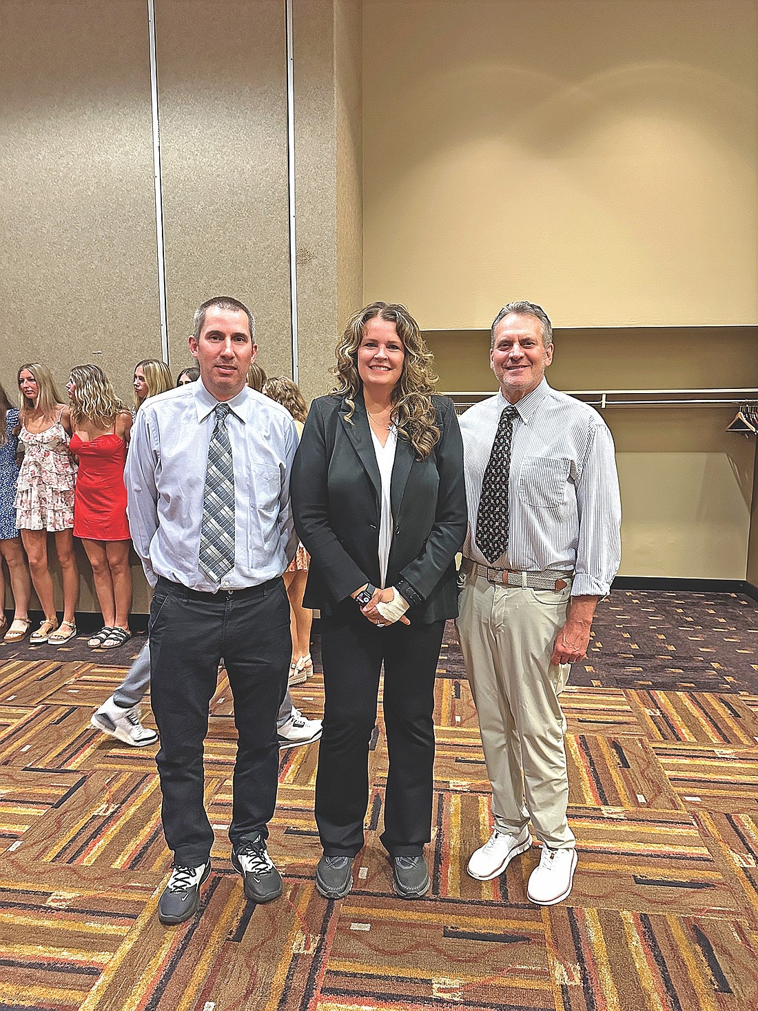 Lakeland coaches, from left, Brad Meade, head coach Melissa Ouimette and Todd McEldowney pose for a photo during the Wisconsin Basketball Coaches Association (WBCA) Division 2 All-Star Game banquet Tuesday, June 24 in Wisconsin Dells. Together, Ouimette, McEldowney and Meade coached the North All-Stars. (Contributed photograph)