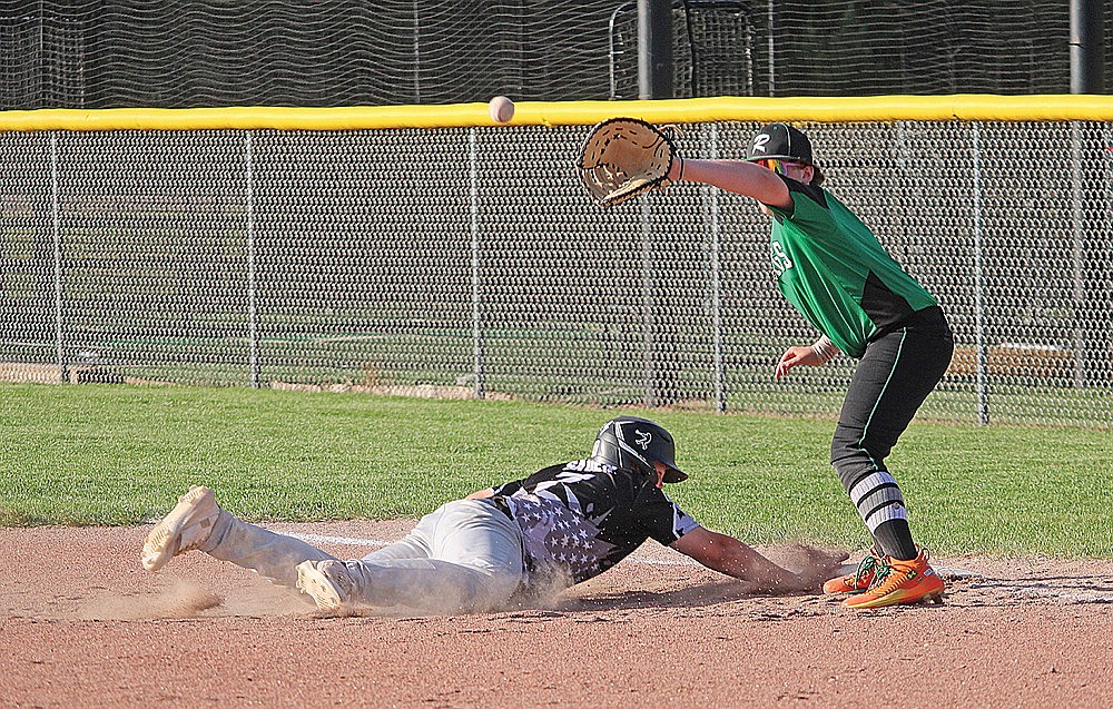 Rhinelander’s Finn Brown fields a throw to first as Lakeland-1’s Owen Sauer dives back to the base during a Northwoods Babe Ruth Prep League baseball game in Minocqua Wednesday, July 2. (Trevor Greene/Lakeland Times)