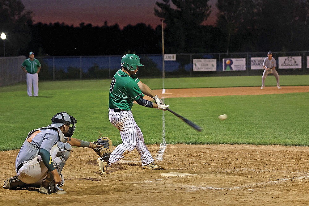 Rhinelander’s Easton Senoraske doubles during the seventh inning of a Dairyland League baseball game against the Minocqua Wood Ducks at Stafford Field Wednesday, July 9. (Bob Mainhardt for the River News)