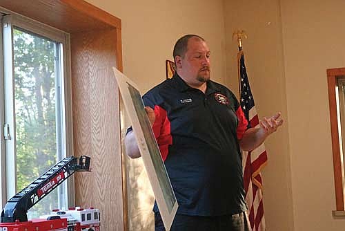 Volunteer fire department lieutenant Randy Frahm approached the Crescent town board with plans for a fire department training center, which would be created with old shipping containers and located near the old town dump. (Photo by Beckie Gaskill/Lakeland Times)