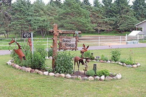 One of the defining features of Bradle Stables Peaceful Wandering (one of this year’s feature gardens) is the horseshoe garden filled with colorful perennials. (Photo by Michael Strasburg/Lakeland Times)