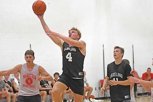 Evan Zoch rises for a layup in the second half of a summer league game against Marathon Tuesday, July 15 at Wausau East High School. (Photo by Brett LaBore/Lakeland Times)