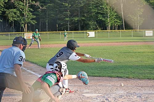 Nat Decora attempts to lay down a bunt against Rhinelander Monday, July 14 at the Minocqua Park Complex. (Photo by Bob Mainhardt for the River News)