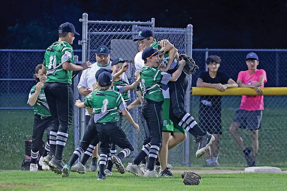 The Rhinelander Little League All-Star team celebrates after winning the District 5 tournament with a 3-1 victory over Wausau American in Wausau Tuesday, July 14. (Jeremy Mayo/River News)