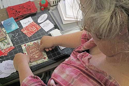 Sherill Willis and a few of her friends had the idea several years ago to make Christmas cards for nursing home residents and other shut-in individuals in the area. This year their goal is to expand and get out even more cards, aiming for 1,000. (Photo by Beckie Gaskill/Lakeland Times)
